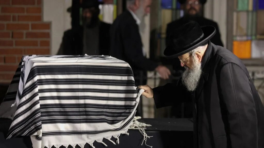 A mourner attends the funeral of Israeli-Moldovan rabbi Tzvi Kogan in Kfar Chabad, a Chabad-Lubavitch community in central Israel, on November 25, 2024. (Gil Cohen-Magen / AFP)
