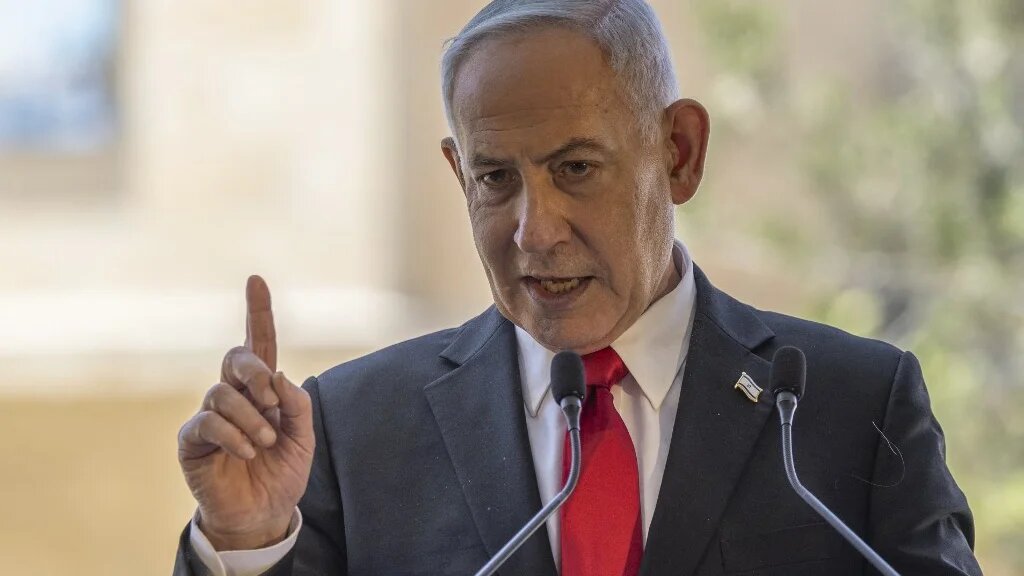 Israel's Prime Minister Benjamin Netanyahu speaks during a cornerstone laying ceremony for the Atarot Jewish Heritage Centre at an abandoned Palestinian airport in occupied East Jerusalem on 5 July 2026 (Ilia Yefimovich/AFP)