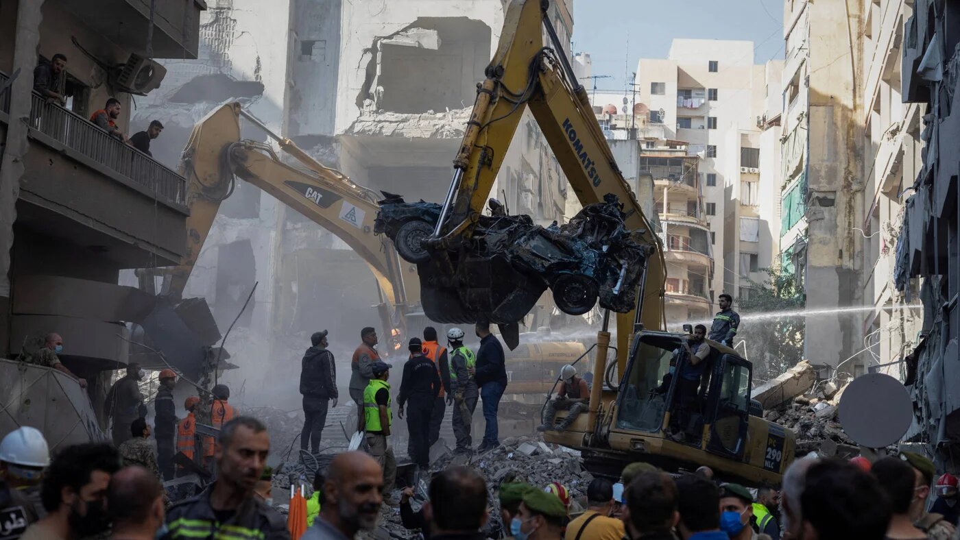 Civil defence members work at the site of an Israeli strike in Beirut's Basta al-Fawqa neighbourhood, Lebanon, on 23 November 2024 (Reuters)