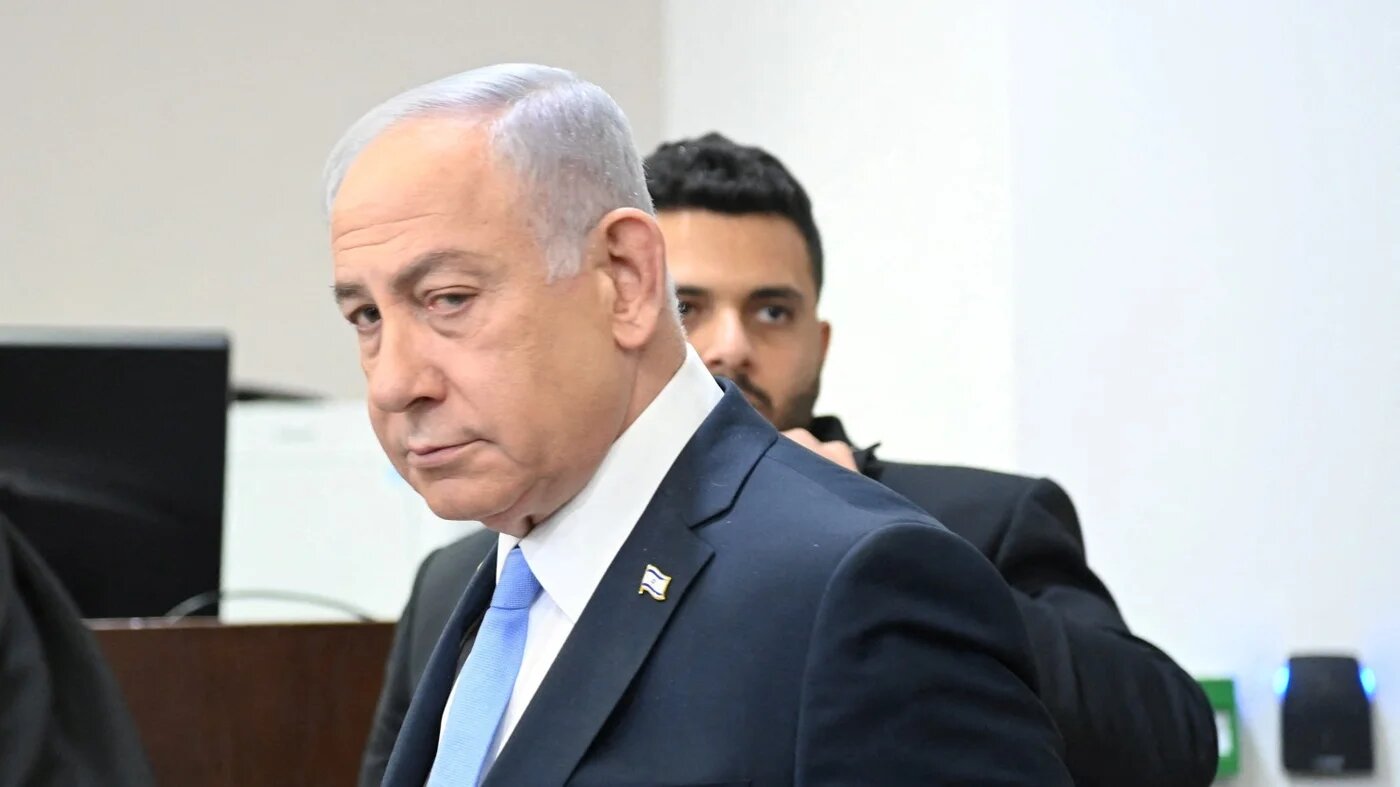 Israeli Prime Minister Benjamin Netanyahu attends his trial on corruption charges at the district court in Tel Aviv, Israel, on 12 February 2025 (Reuters)