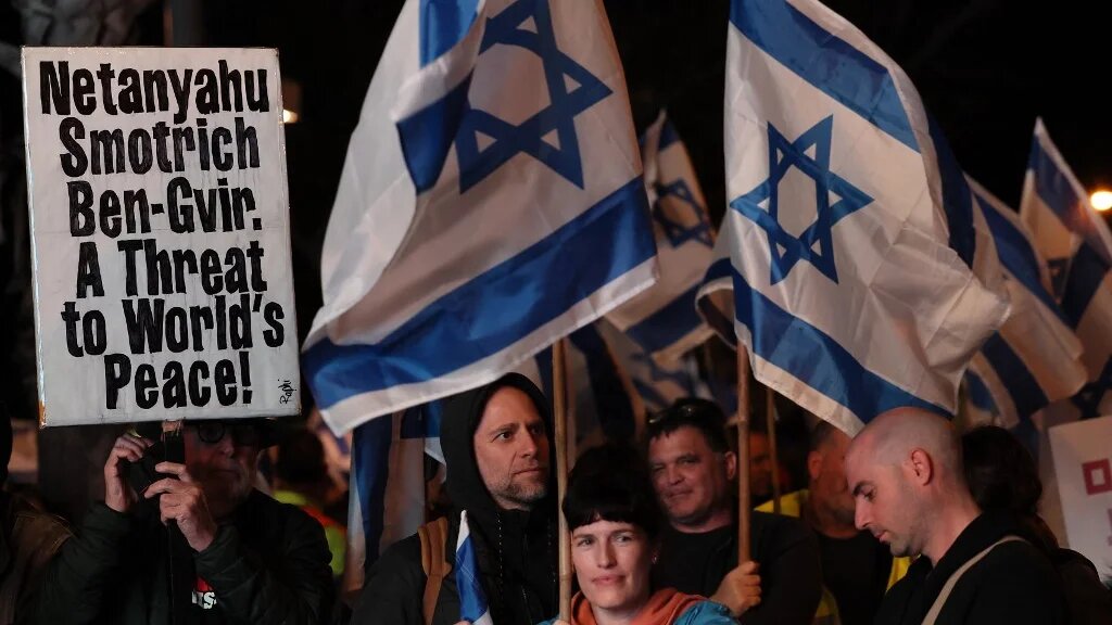Israeli protesters attend a rally against controversial government plans to give lawmakers more control of the judicial system, Tel Aviv, 4 February 2023 (AFP)