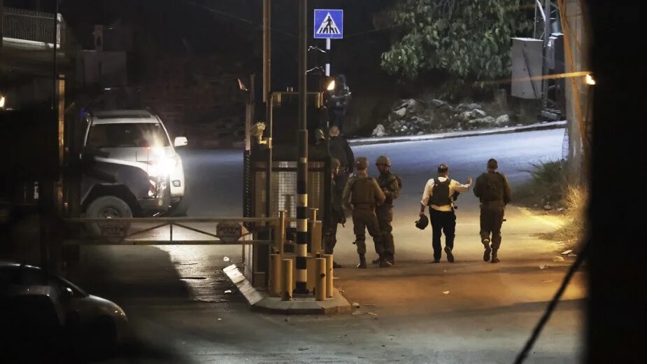 Israeli security forces patrol an area on the outskirts of Hebron, in the southern West Bank, after a gun attack on 29 October 2022 (AFP)