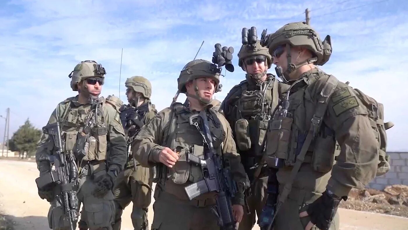 Israeli soldiers operate in a location given as southern Syria, in a screengrab from a video obtained by Reuters on 9 December 2024 (Israel Defense Forces/Reuters)