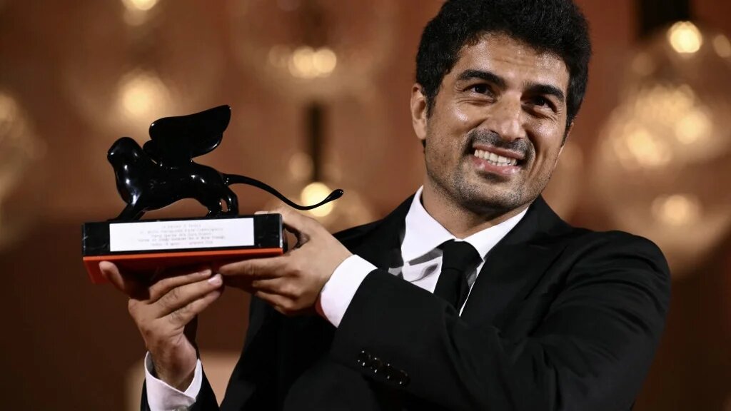 Murat Fıratoglu poses with the Orizzonti Award Special Jury Prize he received for Hemme'nin Oldugu Gunlerden Biri (One of Those days when Hemme dies) during a photocall following the award ceremony of the 81st Venice Film Festival on September 7, 2024 at Venice Lido. (Marco Bertorello/ AFP)
