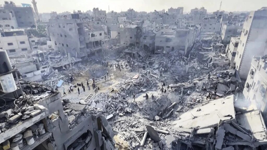 Jabalia refugee camp in Gaza after Israeli air strikes in which experts say precision-guided missiles used (AFP)
