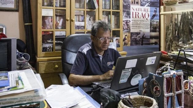 Jassim al-Assadi, director of Nature Iraq, in his office in Chibayish, 120kms northwest of the southern city of Basra, 29 March 2019 (AFP)