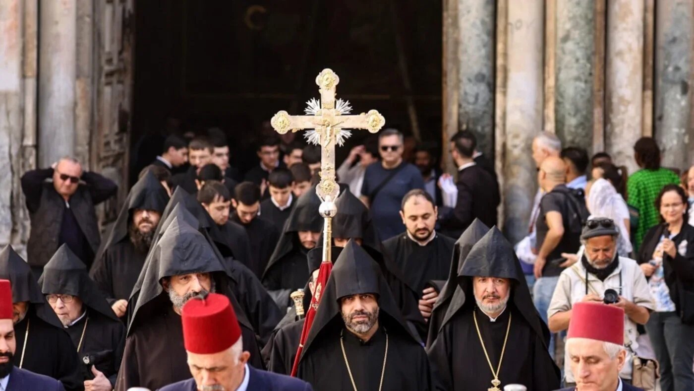 Armenian priests arrive to celebrate Easter mass at the Holy Sepulchre Church in Jerusalem's Old City on April 20 2025 (Gil Cohen-Magen/AFP)