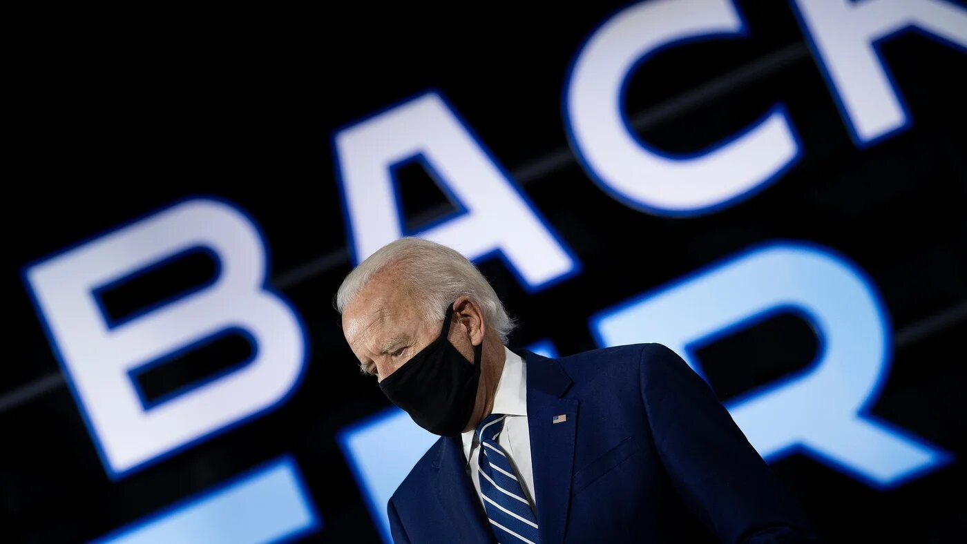 Joe Biden, wearing a black mask