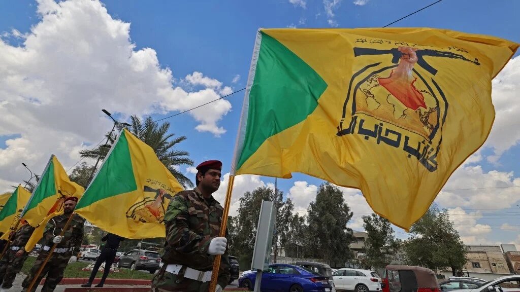 Members of Iraq's pro-Iran paramilitary group Hezbollah Brigades (Kataib Hezbollah) gather in a mourning procession for one of their comrades who was killed the previous day in a strike in Basra, during the funeral in Baghdad on 8 April 2026 (Ahmad al-Rubaye / AFP)