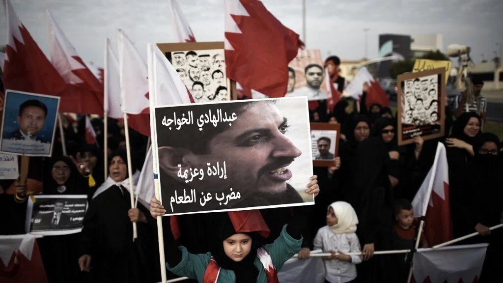 A placard reads "Abdulhadi al-Khawaja, will and determination, hunger strike" during an anti-government protest on 5 September 2014 (AFP/File photo)