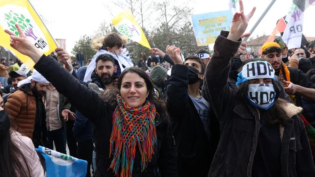 Supporters of Pro-Kurdish Peoples' Democratic Party (HDP) flash the V-sign for victory during a rally as they take part in the Kurdish celebration of Nowruz, the Persian New Year, in Ankara on March 20, 2022. (AFP)
