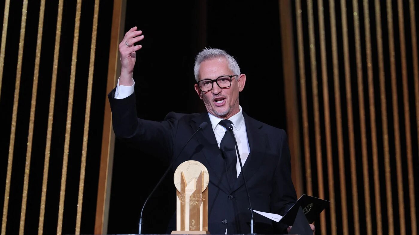 Gary Lineker, former England footballer turned sports TV presenter, gestures on stage with the Gerd Muller Trophy for best striker during the 2023 Ballon d'Or France Football award ceremony at the Theatre du Chatelet in Paris on October 30, 2023 (Franck Fife/AFP)