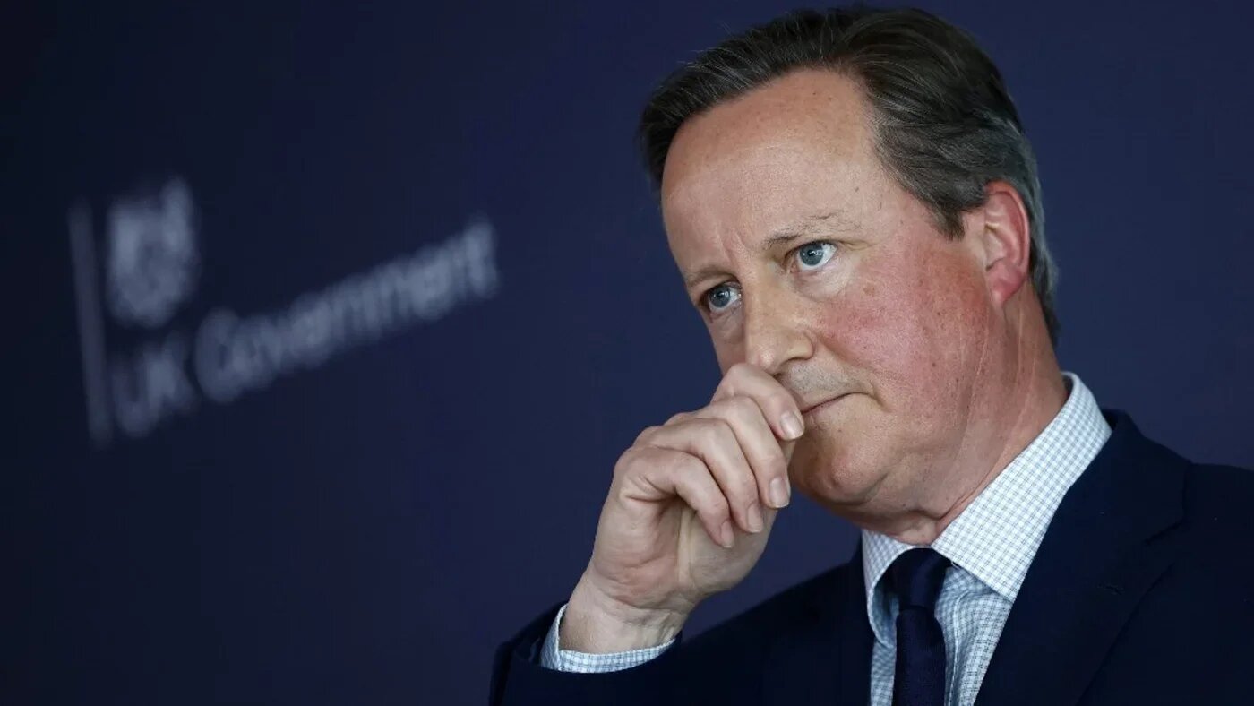 Britain's then-Foreign Secretary David Cameron pauses as he delivers a speech at the National Cyber Security Centre in London on 9 May 2024 (AFP)