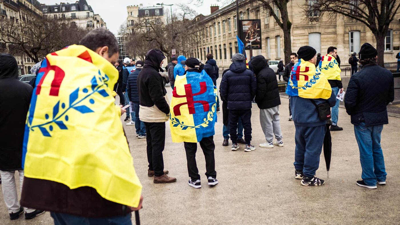 People with Movement for Self Determination of Kabylia flags at a rally in Paris, 26 January 2025 (Bastien Ohier/Hans Lucas via Reuters)
