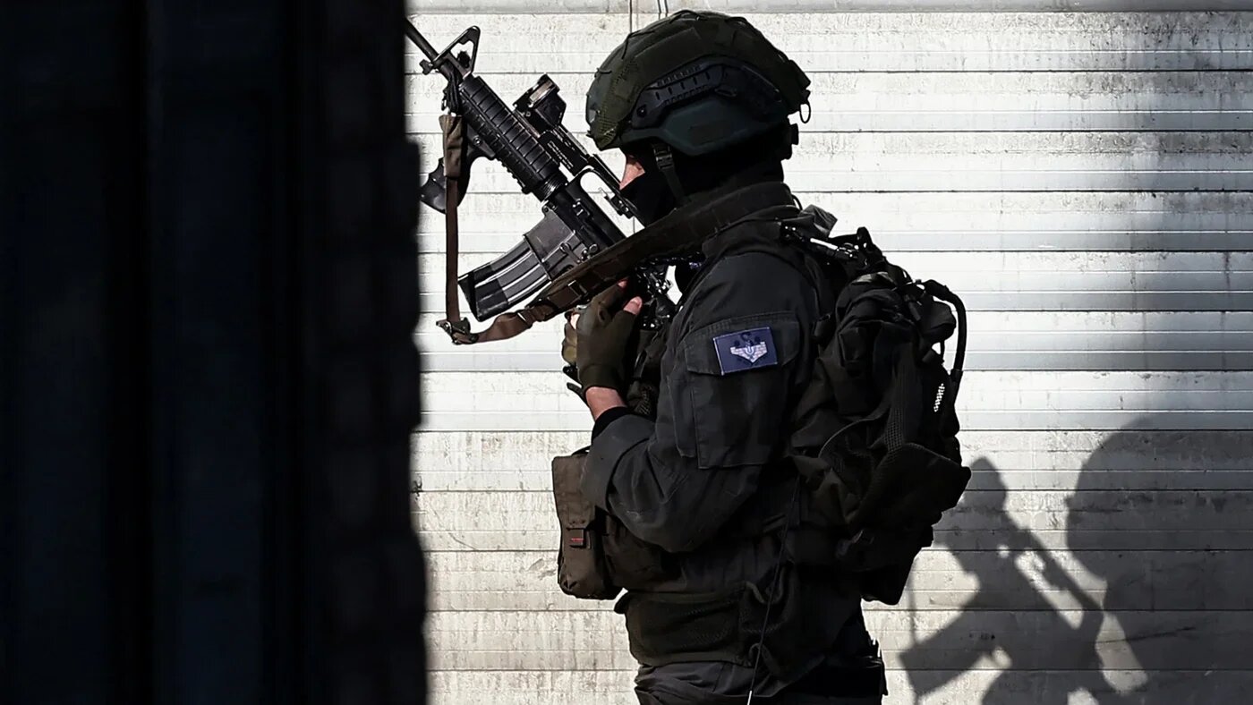 An Israeli soldier during a raid in Nablus city in the occupied West Bank on 20 November 2025 (AFP/Zain Jaafar)