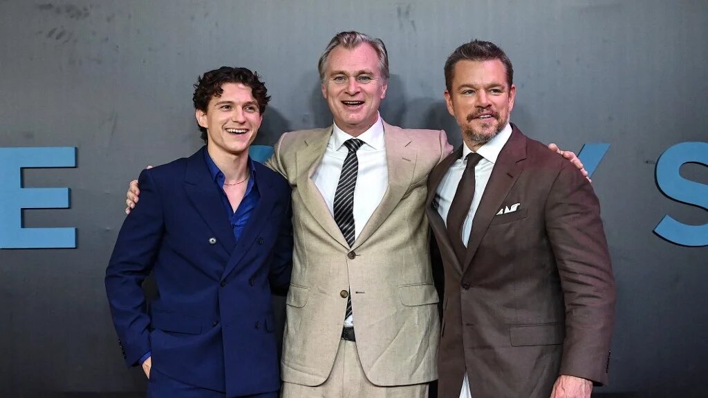 English actor Tom Holland, British-American filmmaker Christopher Nolan and US actor Matt Damon pose upon arrival at the premiere of their film 'The Odyssey' in Mumbai on July 11 2026 (Sujit Jaiswal/AFP)