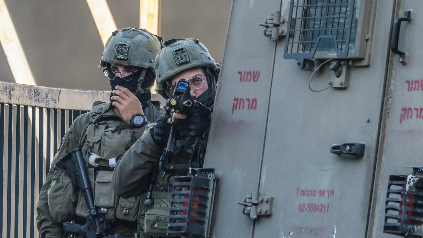 Israeli soldiers take position during a military operation in the occupied West Bank city of Nablus on 11 January 2026. Jaafar ASHTIYEH / AFP