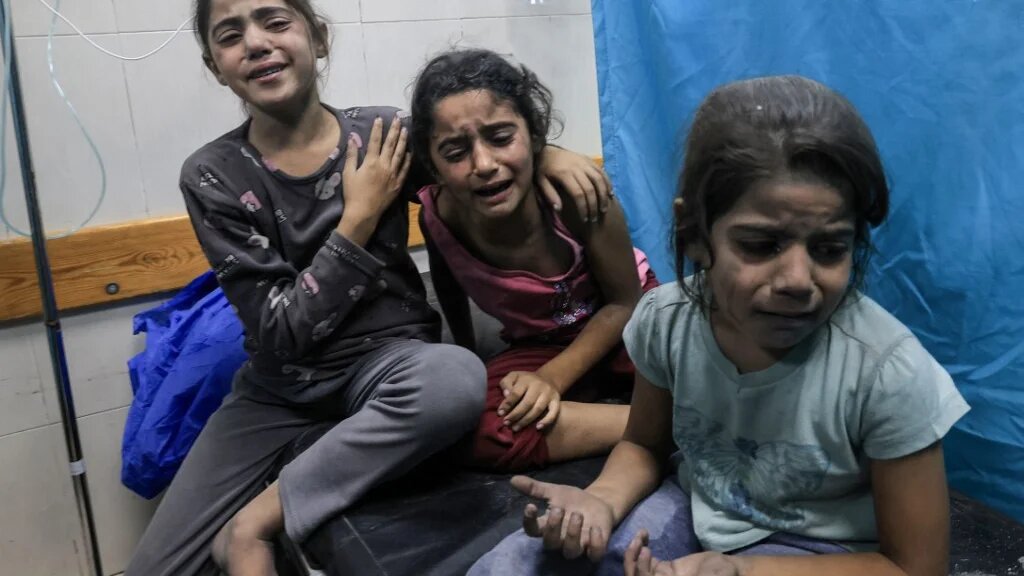 Palestinian children injured in an Israeli air strike await treatment at the Nasser hospital in Khan Yunis in the southern of Gaza Strip, on October 17, 2023