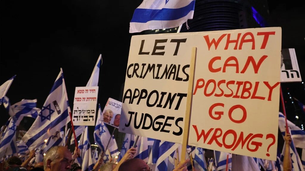 People protest against the hard-right government's controversial judicial reform plans in Tel Aviv, 10 June 2023 (AFP)