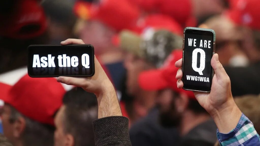 QAnon conspiracy theorists at a Domnald Trump rally