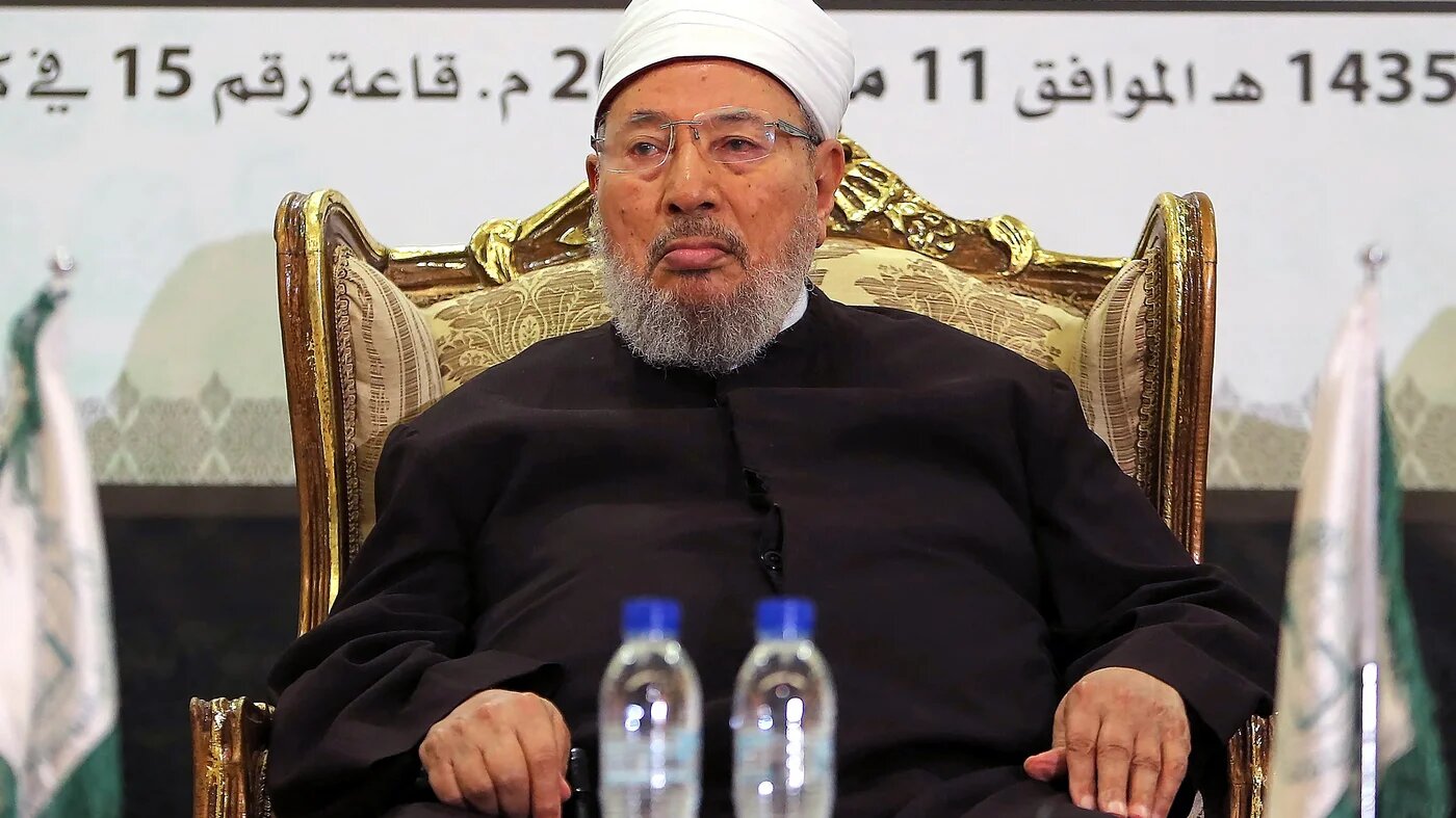 In this file photo, late Egyptian cleric and chairman of the International Union of Muslim Scholars Sheikh Yusuf al-Qaradawi attends a seminar in Doha, Qatar on 11 May 2014 (AFP)