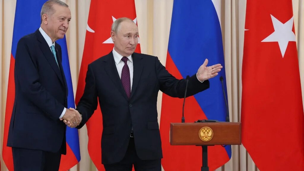This handout photograph taken and released by the Turkish Presidency Press Office on September 4, 2023, shows Russian President Vladimir Putin (R) and his Turkish counterpart Recep Tayyip Erdogan (L) shaking hands after a press conference following a meeting in Sochi. (AFP)