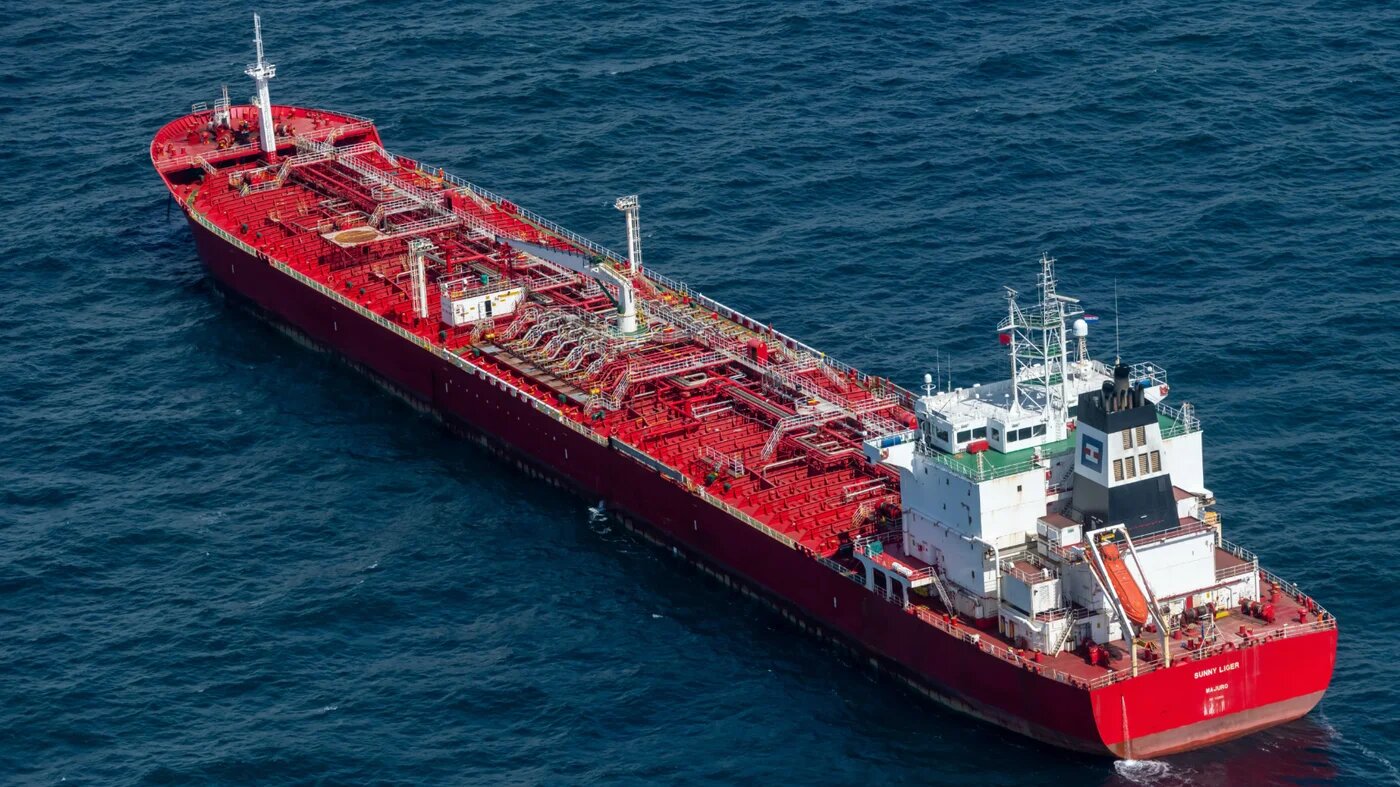 An aerial view shows a Marshall Islands-flagged tanker with a consignment of Russian diesel, anchored in the North Sea, near IJmuiden, on 30 April 2022 (AFP)