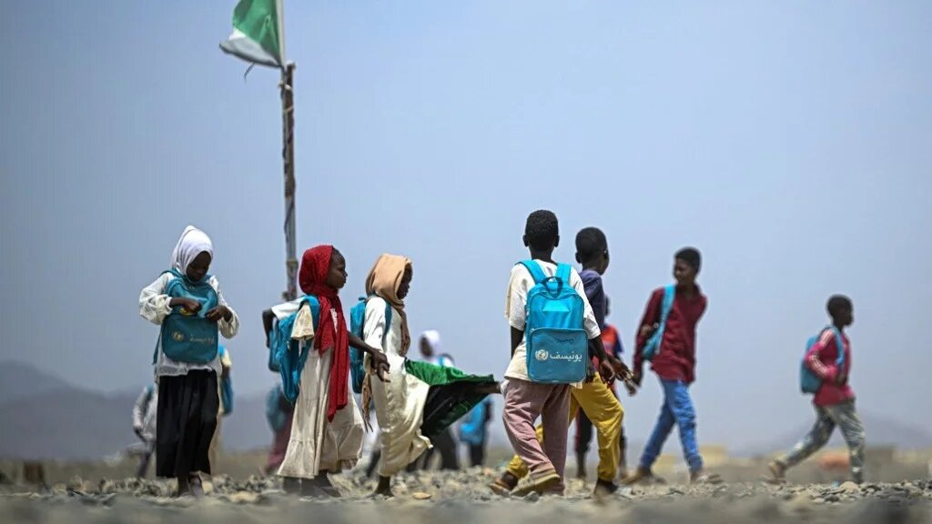 Sudanese students leave a school operated by the Sudanese Coalition for Education for All, in partnership with the United Nations International Children's Emergency Fund (UNICEF), south of Port Sudan on April 26, 2026 (Khaled Desouki / AFP)