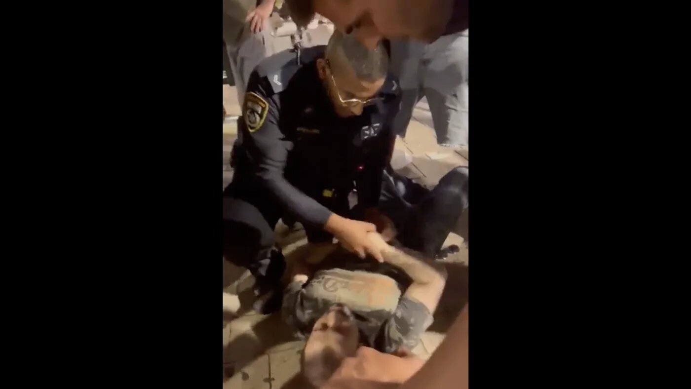 Israeli officer arresting UAE tourist