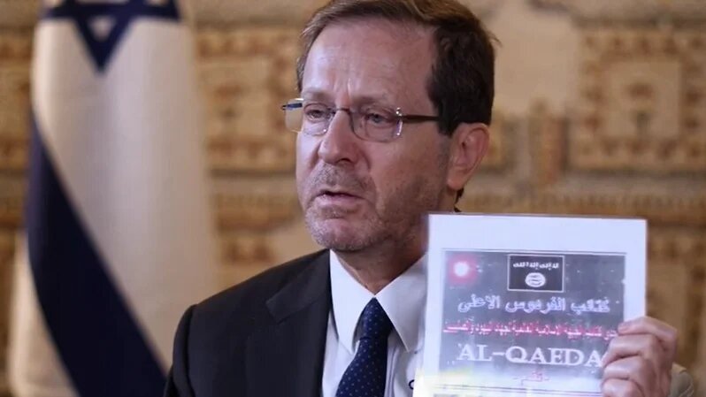 Israeli President Isaac Herzog produces a page from the al-Qaeda document on Sky News (screengrab)
