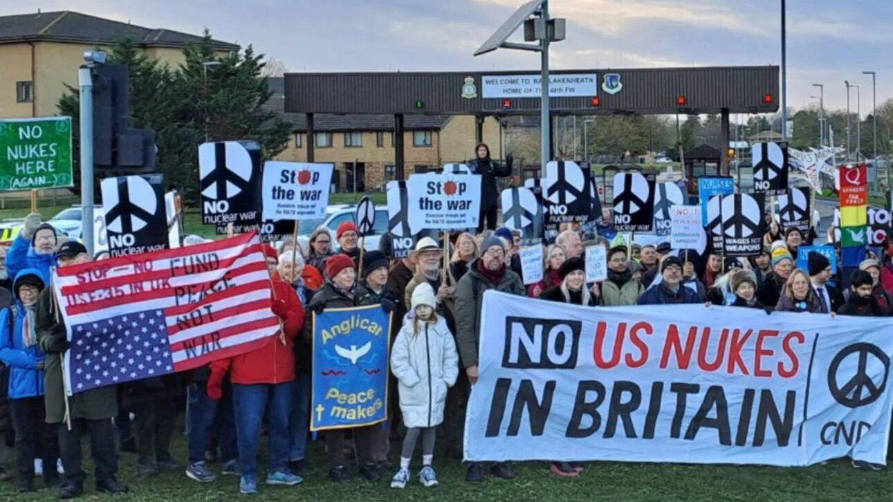 Protesters stand outside the RAF Lakenheath military base last week to demonstrate over the US use of the airfield. (Screengrab/X)