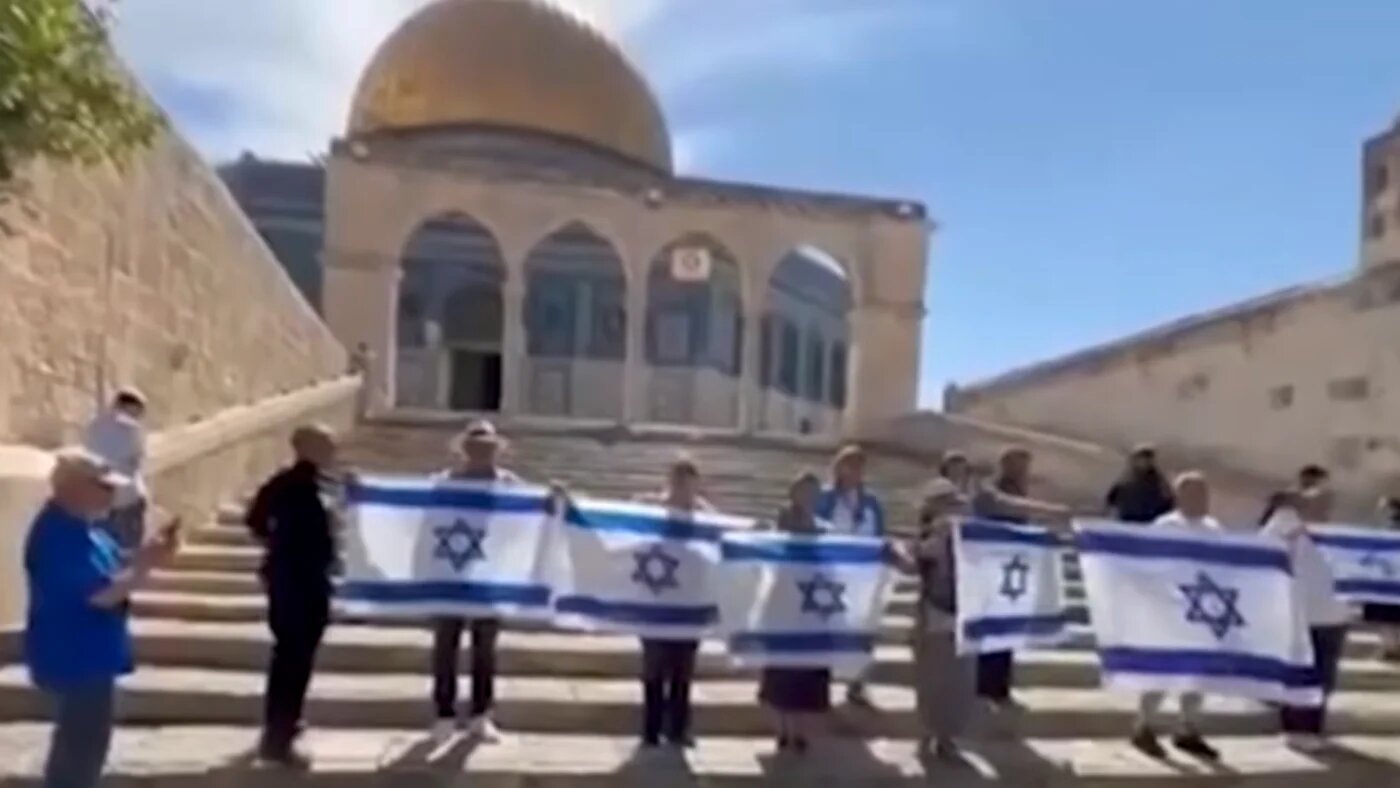 Israeli ultranationalists raise the national flag and sing the anthem in front of the Dome of the Rock inside Al-Aqsa Mosque in occupied East Jerusalem on 31 May 2026 (X/Screengrab)