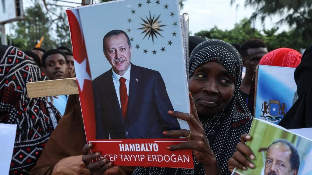 Somalis celebrate the victory of Turkish President Recep Tayyip Erdogan after he won the run-off presidential election during the celebrations organised by the government in Mogadishu on 29 May 2023 (Hassan Ali Elmi/AFP)