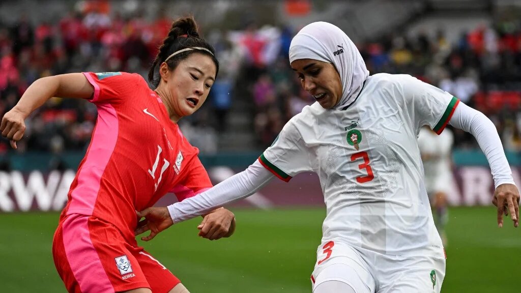 Morocco's Nouhaila Benzina (R), made history when she became the first player to wear a hijab at a World Cup in her side's victory against South Korea Stadium in Adelaide on 30 July 2023 (AFP)