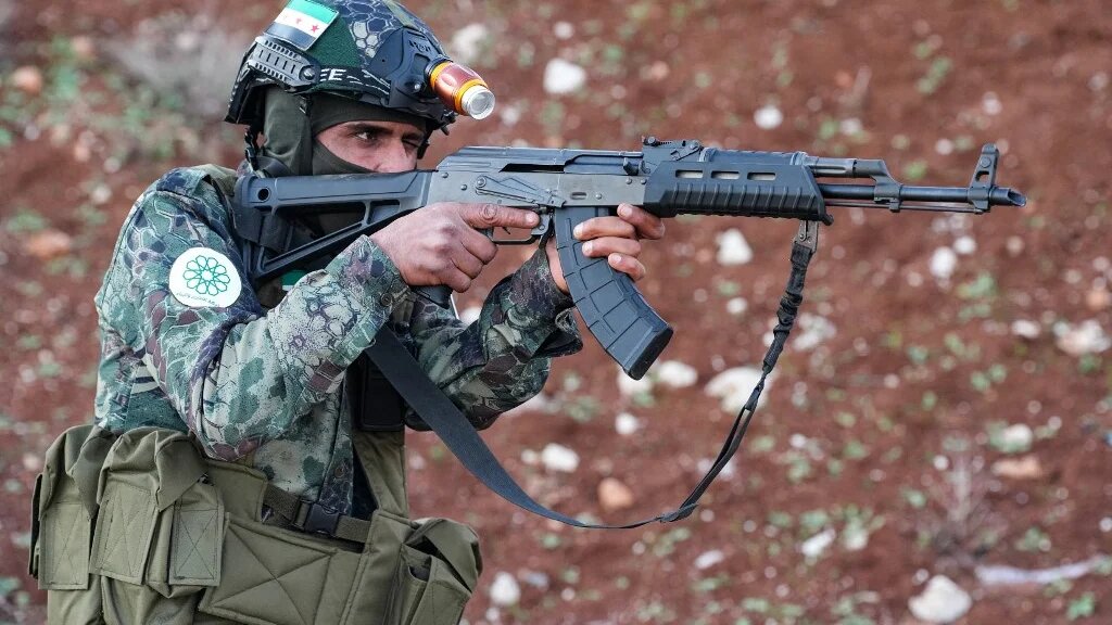 In this picture, taken on 18 December 2023, a Syrian opposition fighter trains near the border with Turkey (AFP/Rami al-Sayed)