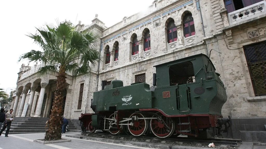An old locomotive sits outside the Hejaz rail station in old Damascus on February 23, 2010. The Hejaz railway ran from Damascucs to Medina in Saudi Arabia and was part of the Ottoman railway network. (Louai Beshara / AFP)