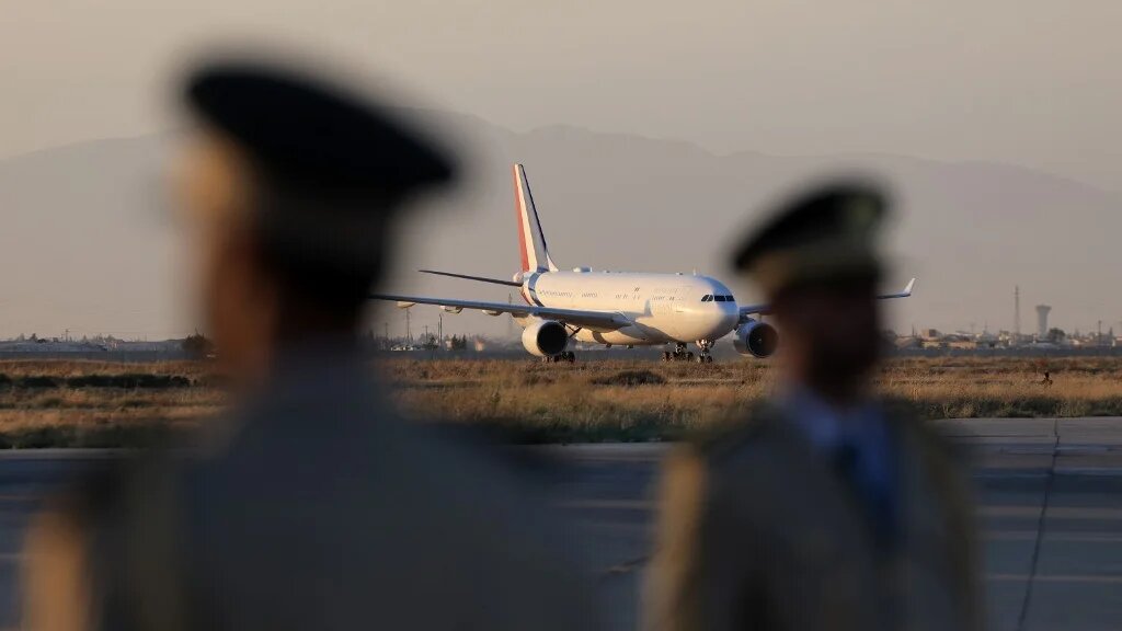 The plane transporting France's President lands at the Damascus International Airport in Damascus on July 6, 2026. French President Emmanuel Macron arrived in Damascus on July 6, 2026.  (Ludovic MARIN / AFP)