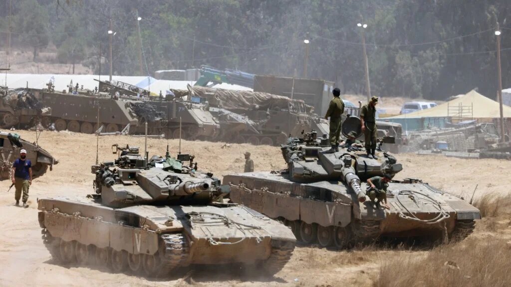 Israeli army tanks deploy in an area of Israel's southern boundary with the Gaza Strip on 5 June (Jack Guez/AFP)