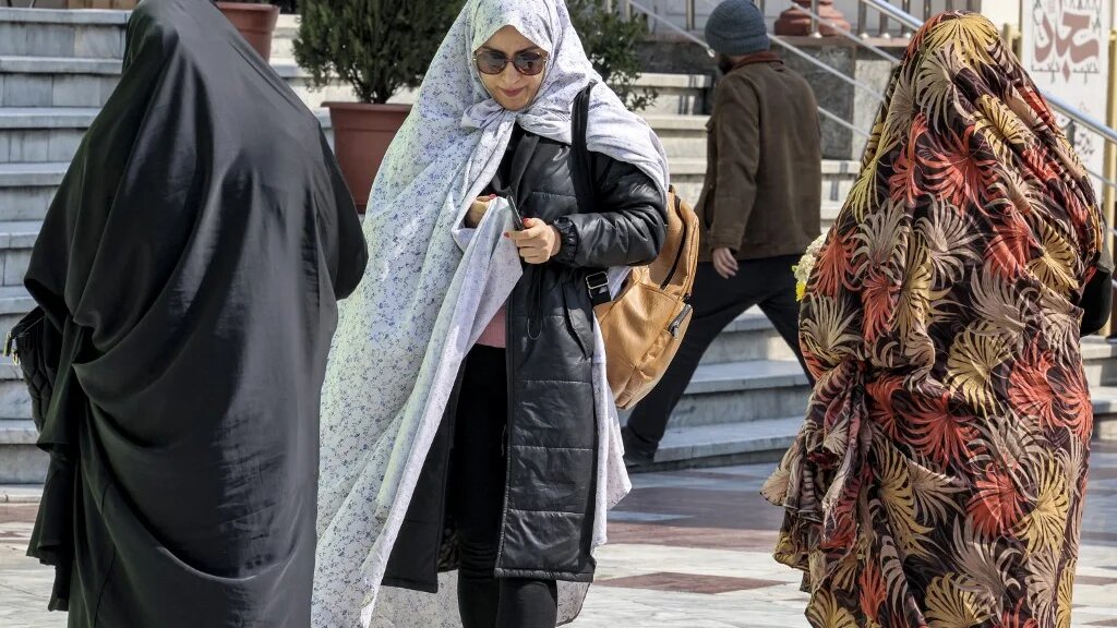People walk outside at the Emamzadeh Saleh mosque in Tajrish square in northern Tehran on 12 March 2024, the first day of the holy fasting month of Ramadan in Iran (Atta Kenare/AFP)