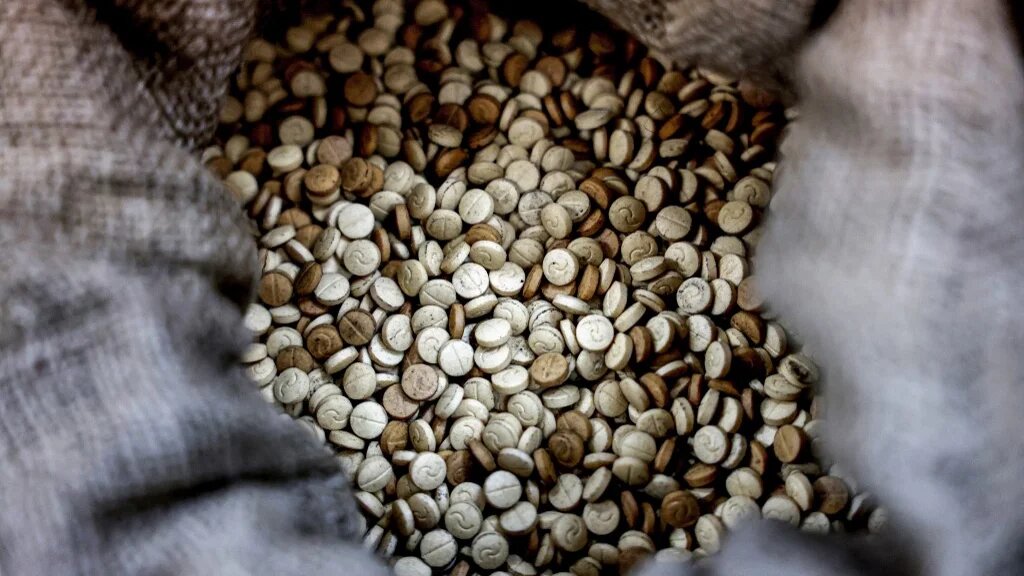 This picture taken on July 27, 2022 shows a view of sacks of confiscated captagon pills at the judicial police headquaters in the town of Kafarshima south of Lebanon's capital Beirut