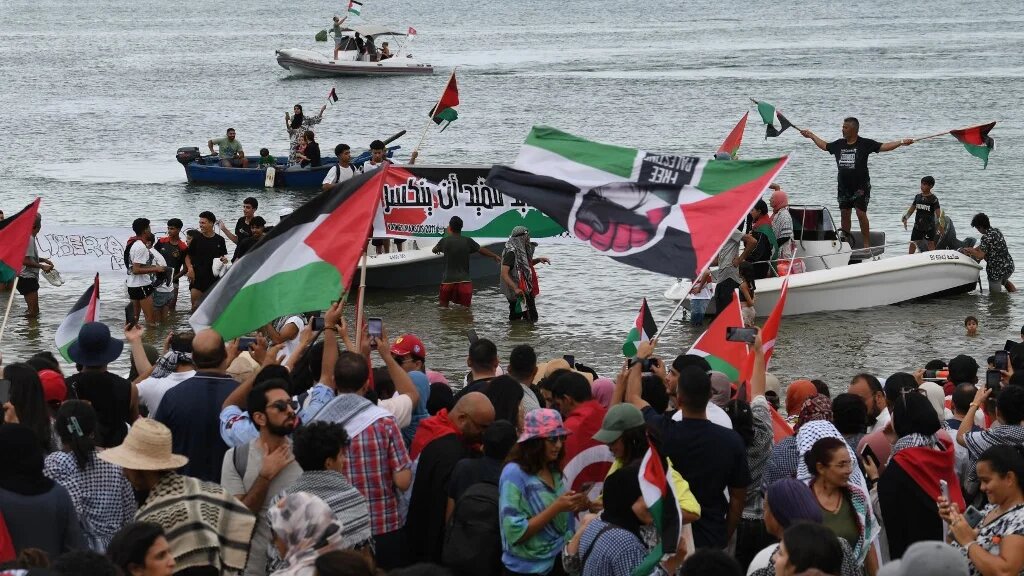 Supporters and activists of the Global Sumud Flotilla gather at the Tunisian port of Sidi Bou Said on 10 September 2025 (Fethi Belaid/AFP)