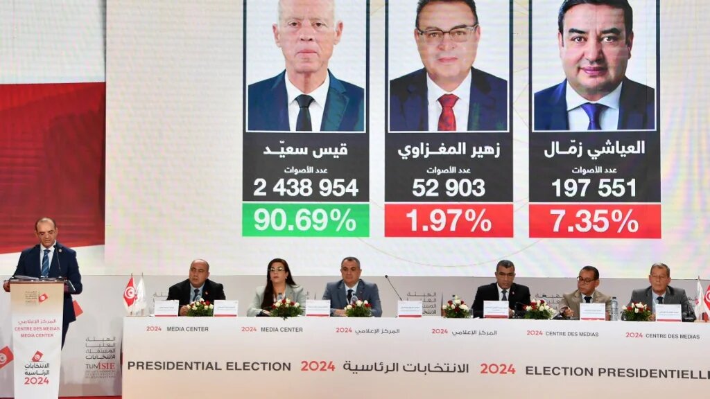 Farouk Bouasker, president of the Tunisian electoral body, announces the presidential elections results during a press conference in Tunis on 7 October (Fethi Belaid/AFP)