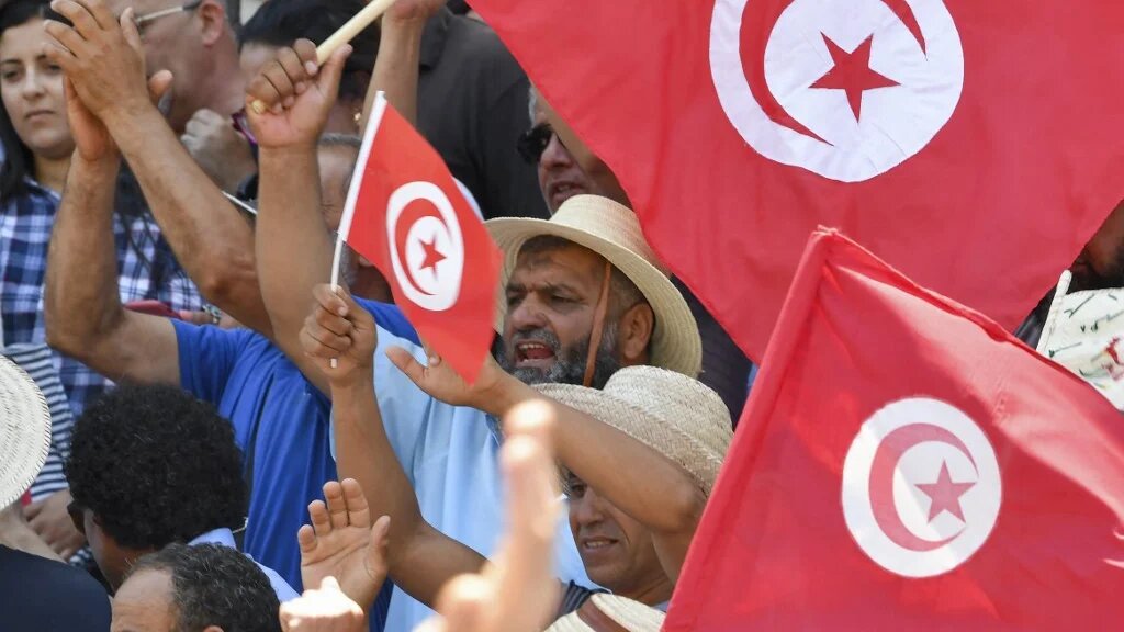 Tunisian protesters chant slogans against President Kais Saied and the upcoming constitutional referendum to be held on 25 July, at a rally in the capital Tunis, 19 June 2022 (AFP)