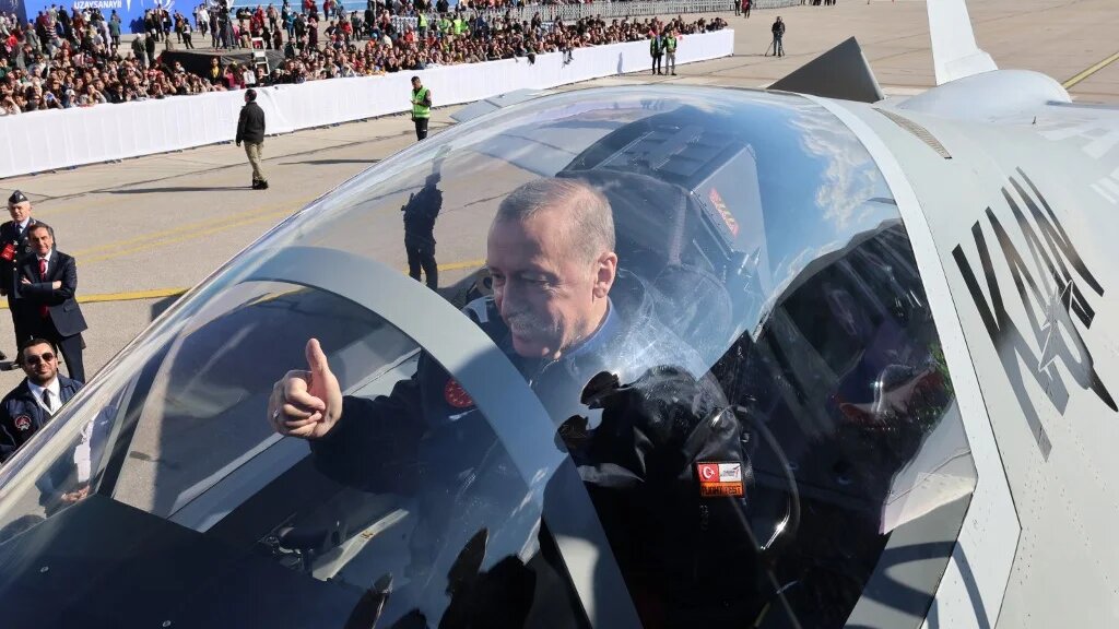 Turkish President Recep Tayyip Erdogan sits in the cockpit of Turkey's national combat "KAAN" at the Turkish Aerospace Industries Headquarters to introduce new aircraft in Ankara on 1 May 2023. (Handout/ AFP)