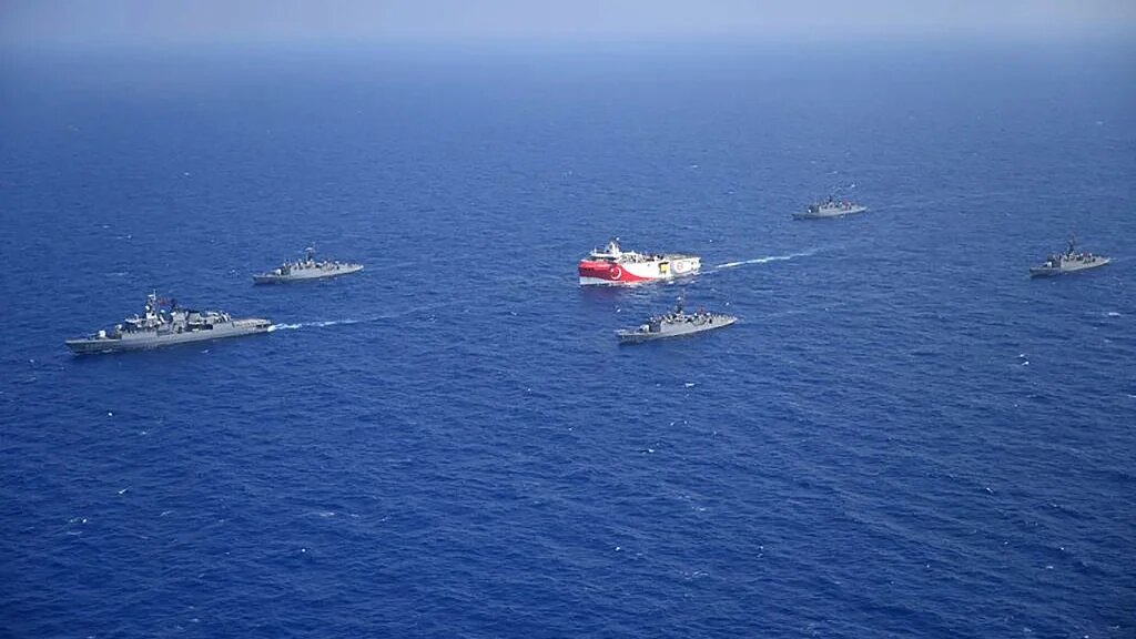 Turkish seismic research vessel 'Oruc Reis' (C) as it is escorted by Turkish Naval ships in the Mediterranean Sea, off Antalya on August 10, 2020.  (Handout / Turkish Defense Ministry)