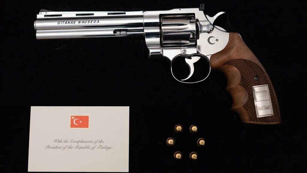 This handout photo, taken on 9 July 2026, shows a revolver offered by Turkish President Recep Tayyip Erdogan to Lithuanian President Gitanas Nauseda, with the president's name engraved, including live rounds (Eitvydas Kinaitis/Office of the Lithuanian president/AFP)