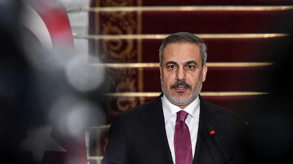 Turkey's Foreign Minister Hakan Fidan during a joint press conference with the Egyptian foreign minister in Cairo on 14 October 2023 (AFP)