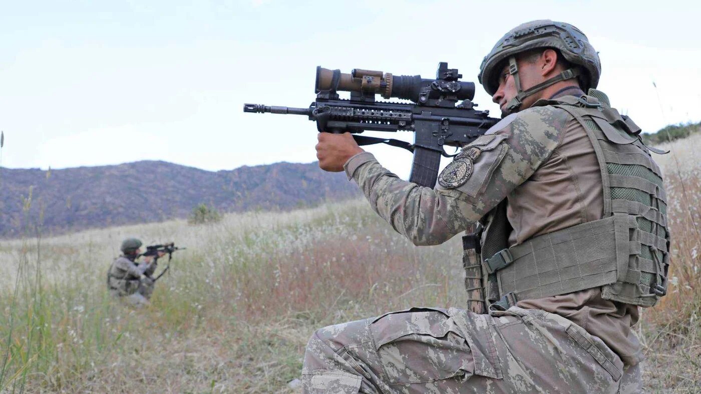 A Turkish soldier pose for cameras during a military operation against the PKK (Handout)