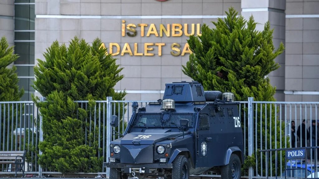 An armored Turkish police vehicle stands outside the courthouse in Istanbul on March 28, 2019,