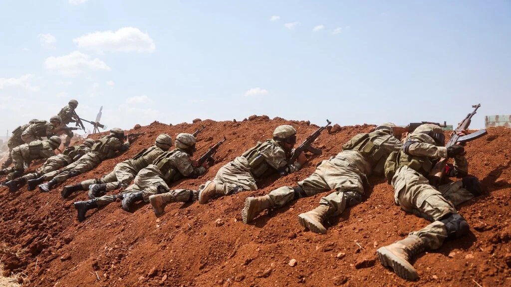 Turkey-backed Syrian fighters take part in a military drill near Marea in the rebel-controlled northern part of Syria's Aleppo province on 29 August 2023 (AFP)